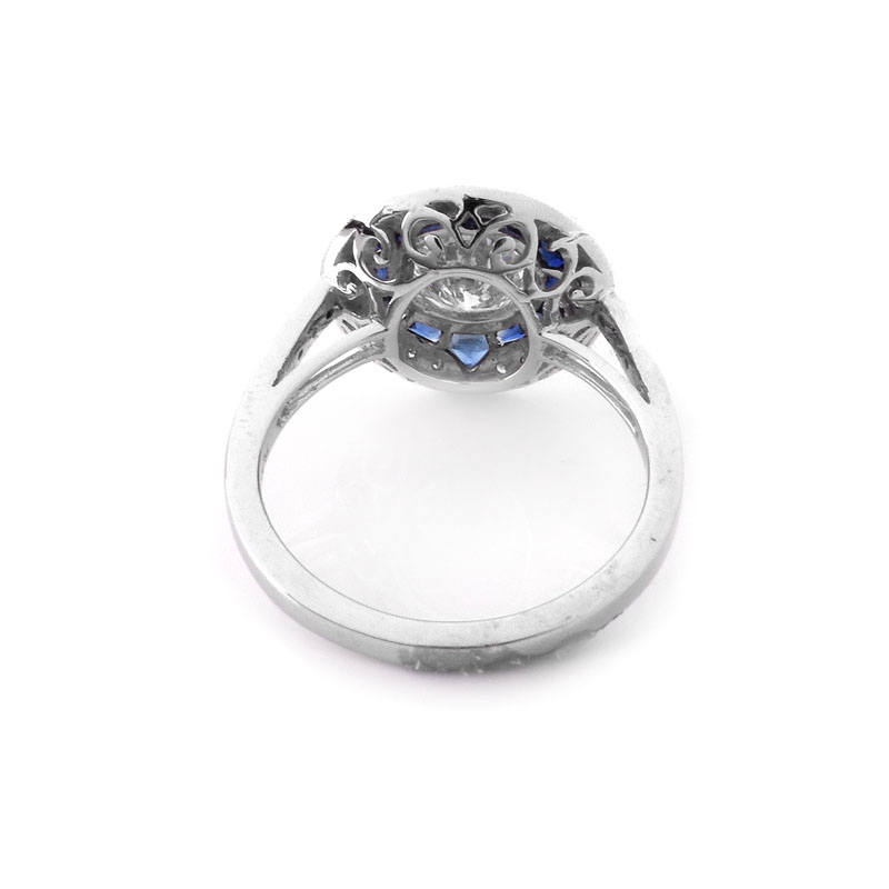 Art Deco style Approx. 1.20 Carat TW Diamond, .64 Carat Sapphire and Platinum Ring set in the Center with a .97 Carat Round Brilliant Cut Diamond. 