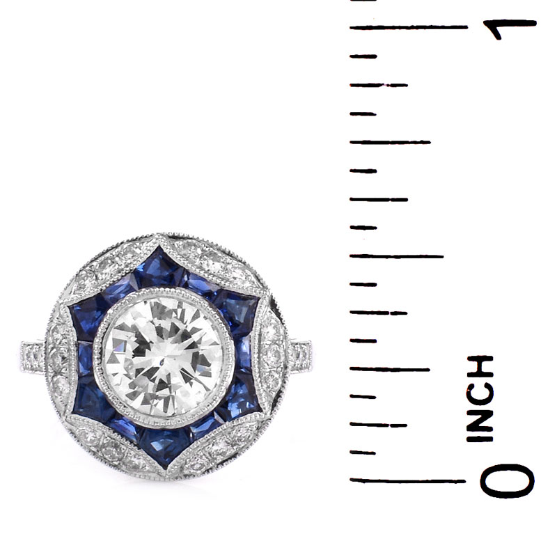 Art Deco style Approx. 1.20 Carat TW Diamond, .64 Carat Sapphire and Platinum Ring set in the Center with a .97 Carat Round Brilliant Cut Diamond. 