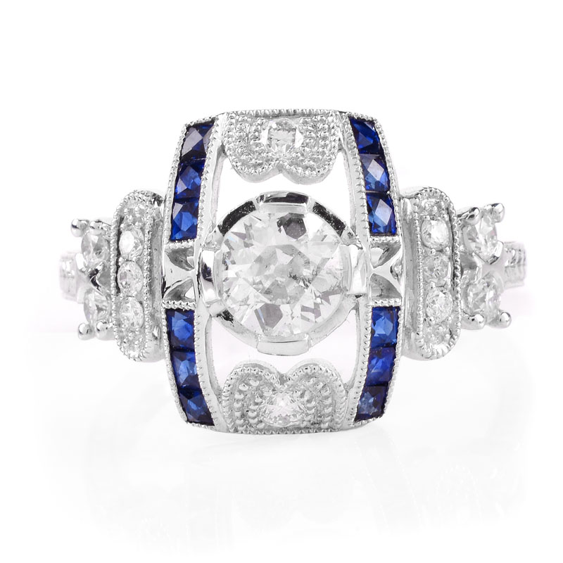 Art Deco style Approx. .86 Carat TW Diamond, .38 Carat Sapphire and Platinum Ring set in the Center with a .55 Carat Round Brilliant Cut Diamond. 