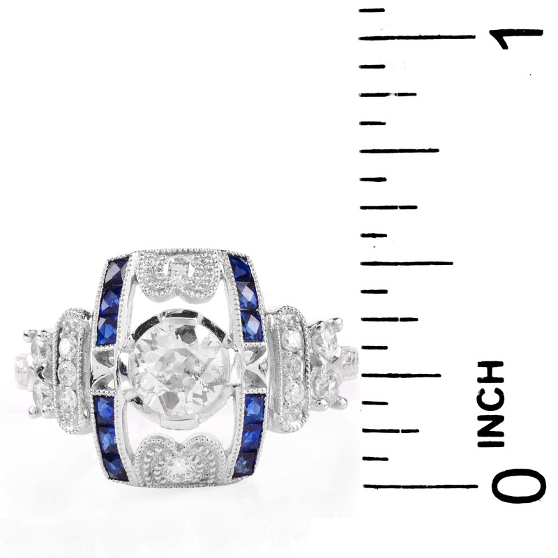 Art Deco style Approx. .86 Carat TW Diamond, .38 Carat Sapphire and Platinum Ring set in the Center with a .55 Carat Round Brilliant Cut Diamond. 