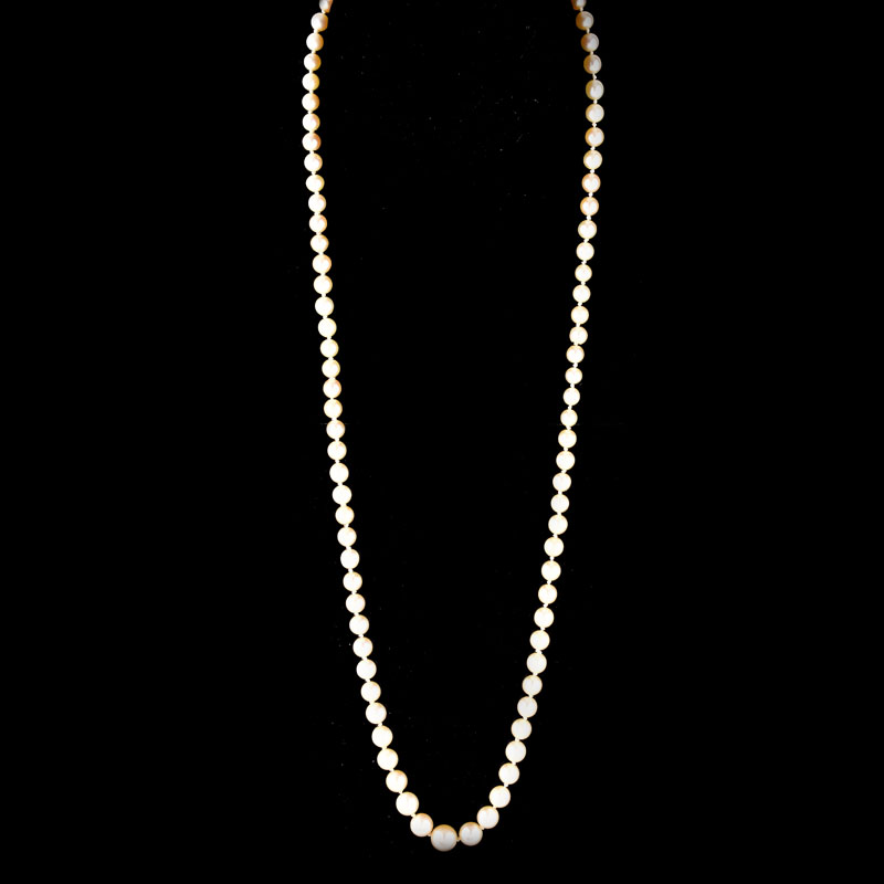 Antique Single Strand Ninety One (91) Graduated White Pearl Necklace with 14 Karat White Gold Clasp.