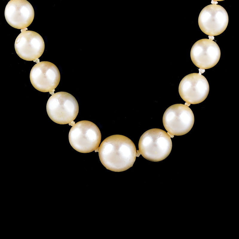 Antique Single Strand Ninety One (91) Graduated White Pearl Necklace with 14 Karat White Gold Clasp.