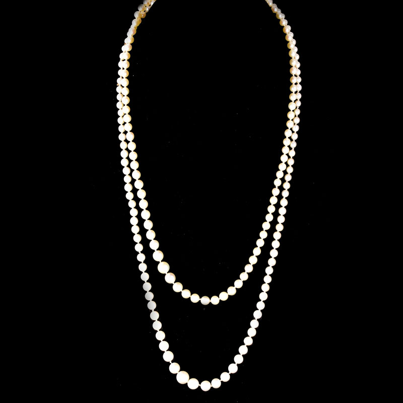 Antique Single Strand One Hundred Ninety Seven (197) Graduated White Pearl Necklace with 14 Karat White Gold Clasp.