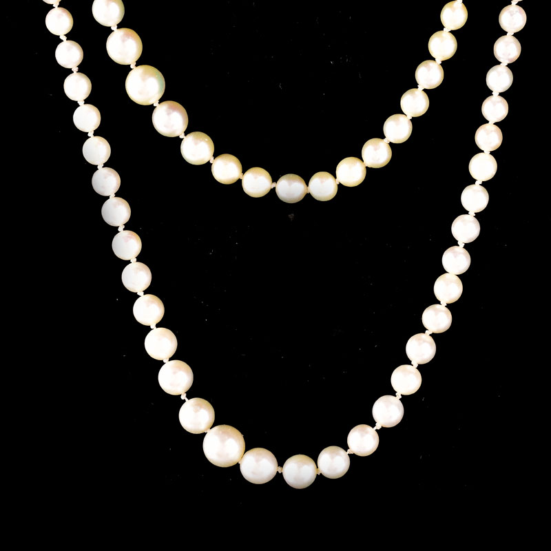 Antique Single Strand One Hundred Ninety Seven (197) Graduated White Pearl Necklace with 14 Karat White Gold Clasp.