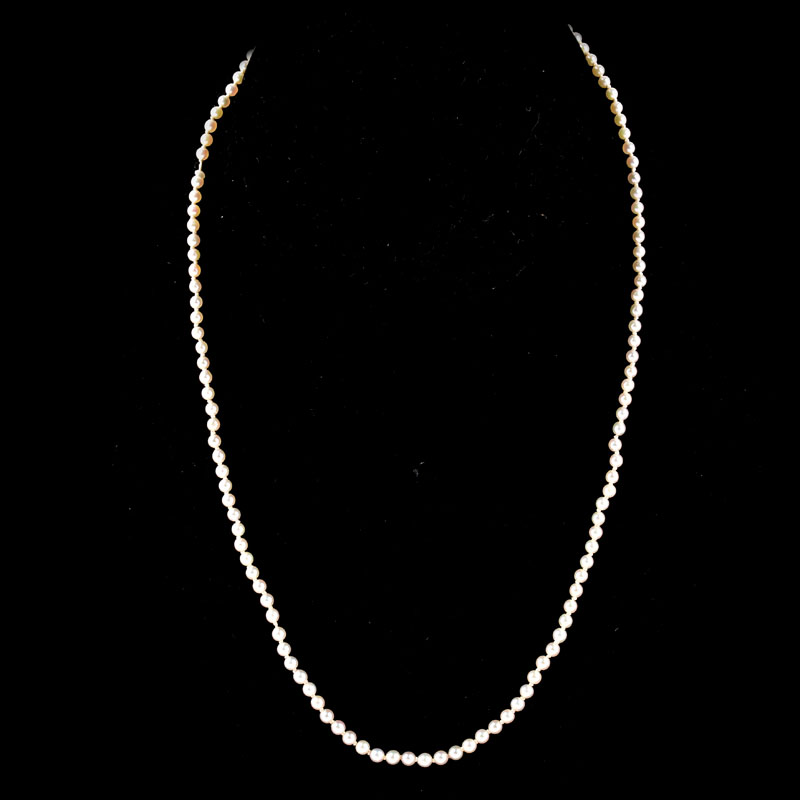 Antique Single Strand One Hundred Twenty Five (125) Graduated White Pearl Necklace with Sterling Silver Clasp.