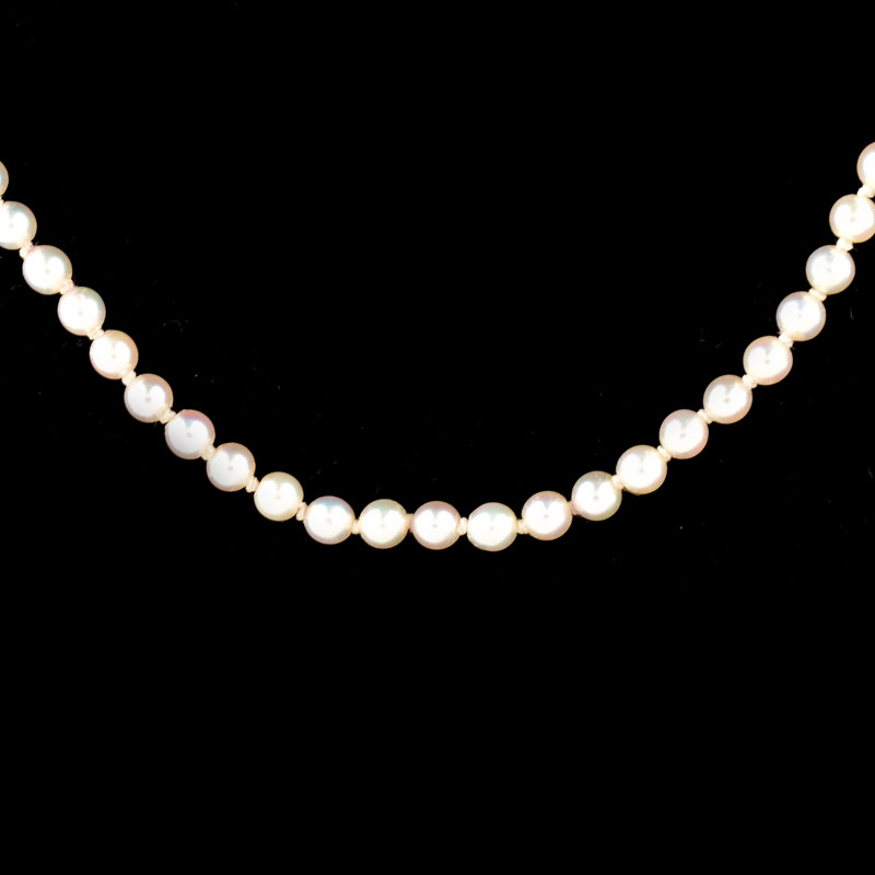 Antique Single Strand One Hundred Twenty Five (125) Graduated White Pearl Necklace with Sterling Silver Clasp.