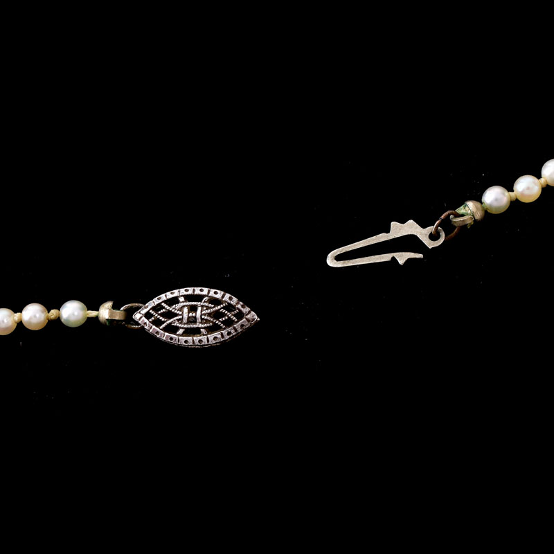 Antique Single Strand One Hundred Twenty Five (125) Graduated White Pearl Necklace with Sterling Silver Clasp.