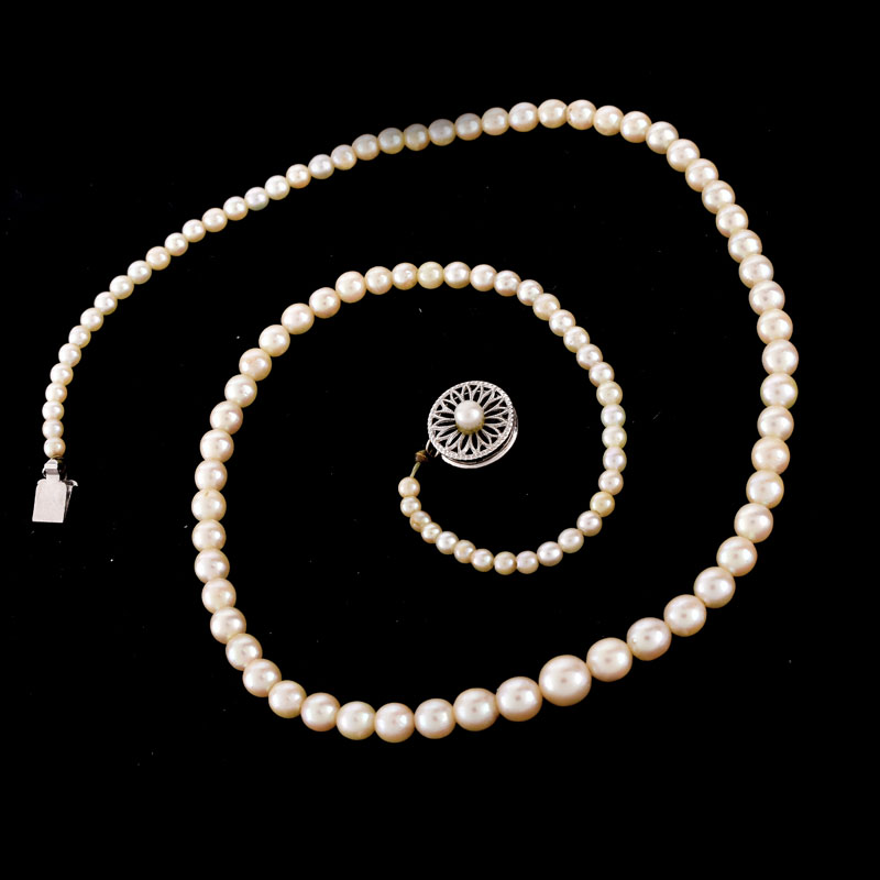 Antique Single Strand One Hundred Six (106) Graduated White Pearl Necklace with 14 Karat White Gold Clasp.