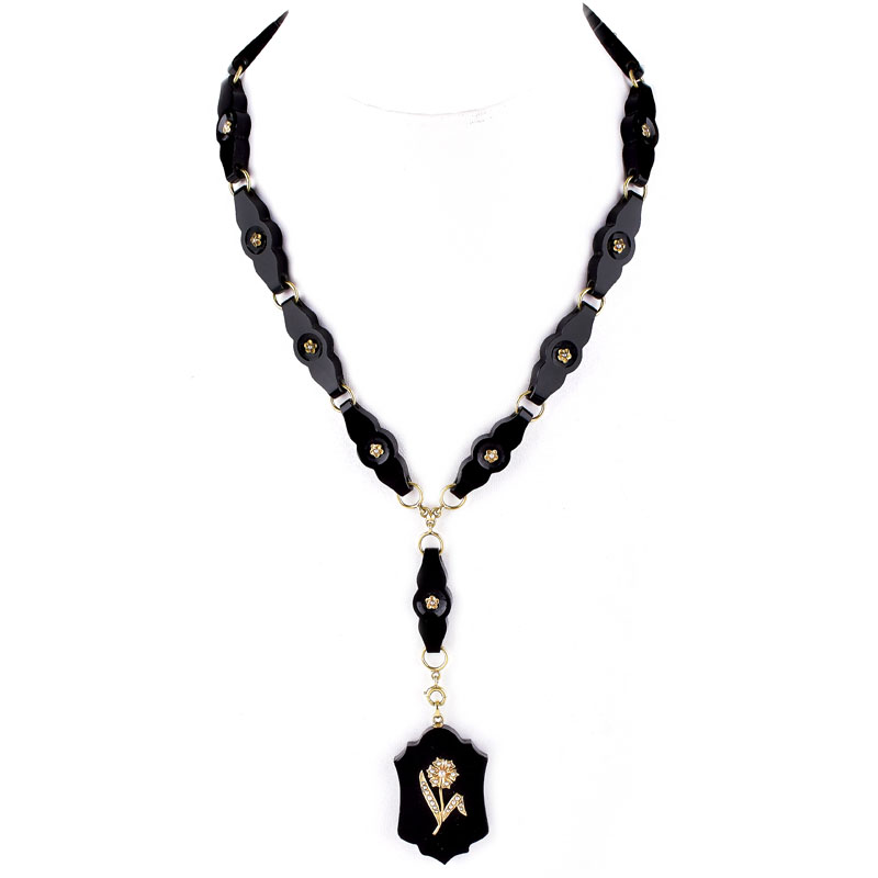 Victorian Carved Black Onyx, 14 Karat Yellow Gold and Seed Pearl Pendant Necklace. Stamped 14K to clasp.