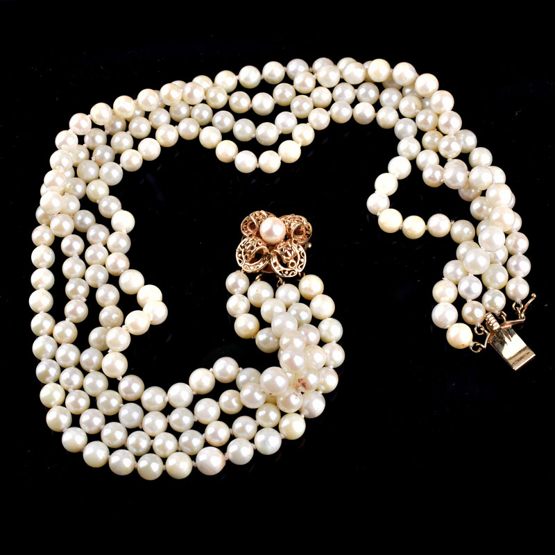 Vintage Four Strand 8mm White Pearl and 14 Karat Yellow Gold Necklace. Stamped 14K to clasp, Pearls with good polish and luster. 