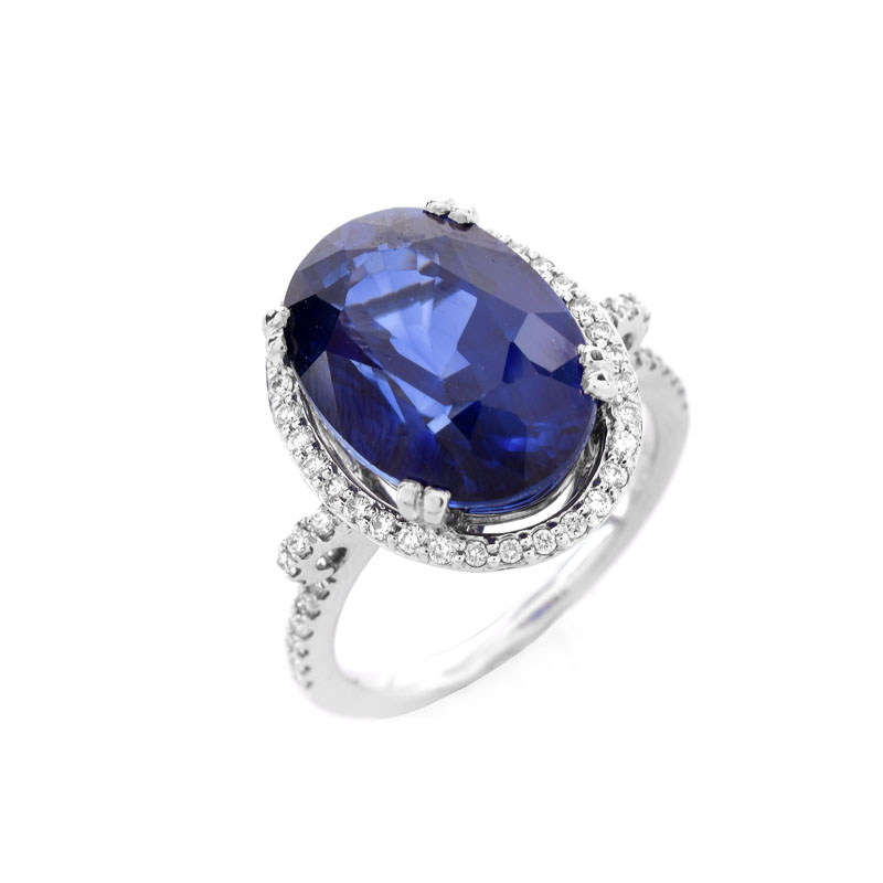 Oval Cut Sapphire, Diamond and 14 Karat White Gold Ring. Sapphire with vivid violet blue color, measures 14mm x 10mm.