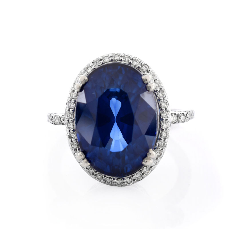 Oval Cut Sapphire, Diamond and 14 Karat White Gold Ring. Sapphire with vivid violet blue color, measures 14mm x 10mm.