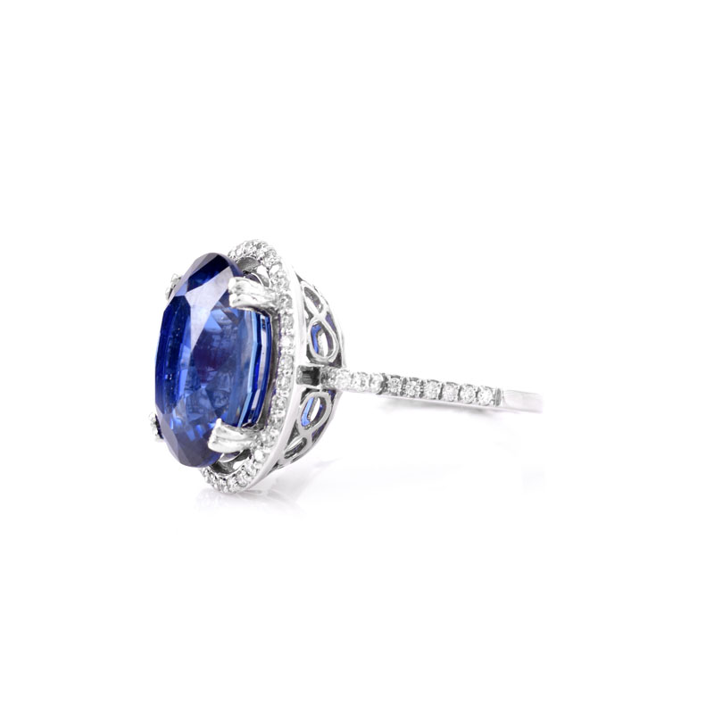 Oval Cut Sapphire, Diamond and 14 Karat White Gold Ring. Sapphire with vivid violet blue color, measures 14mm x 10mm.