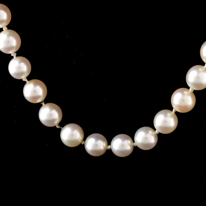 Vintage Single Strand Pearl Necklace with Gold Filled Clasp. Pearls measure 7mm each. Unsigned.