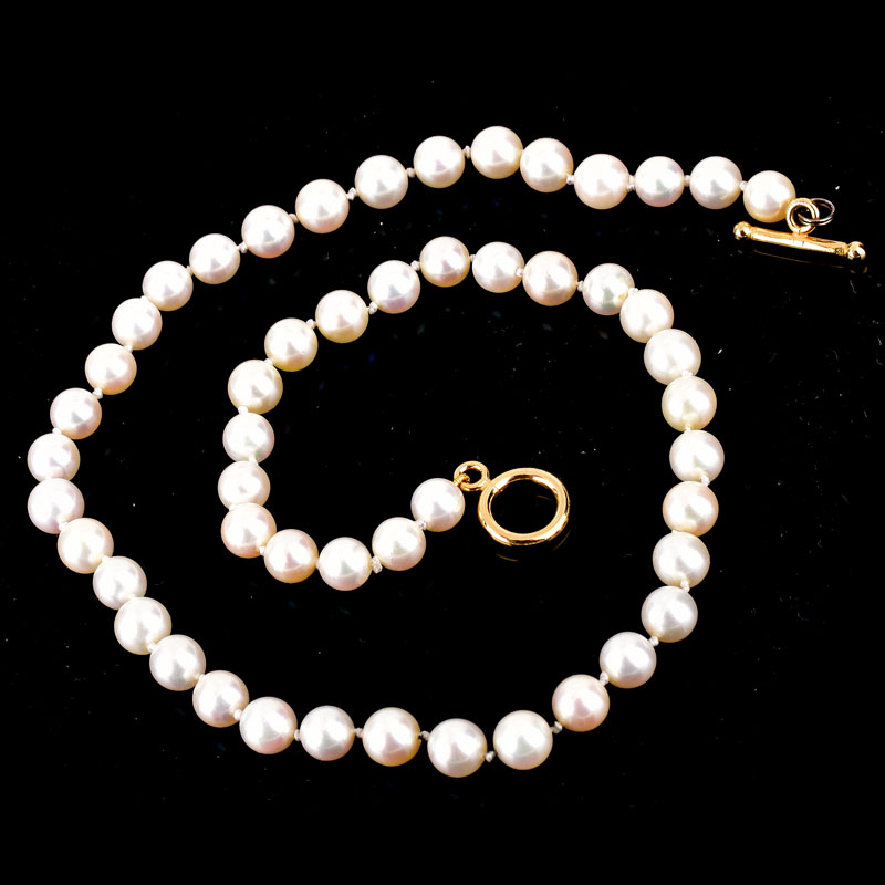 Vintage Single Strand Pearl Necklace with Gold Filled Clasp. Pearls measure 7mm each. Unsigned.