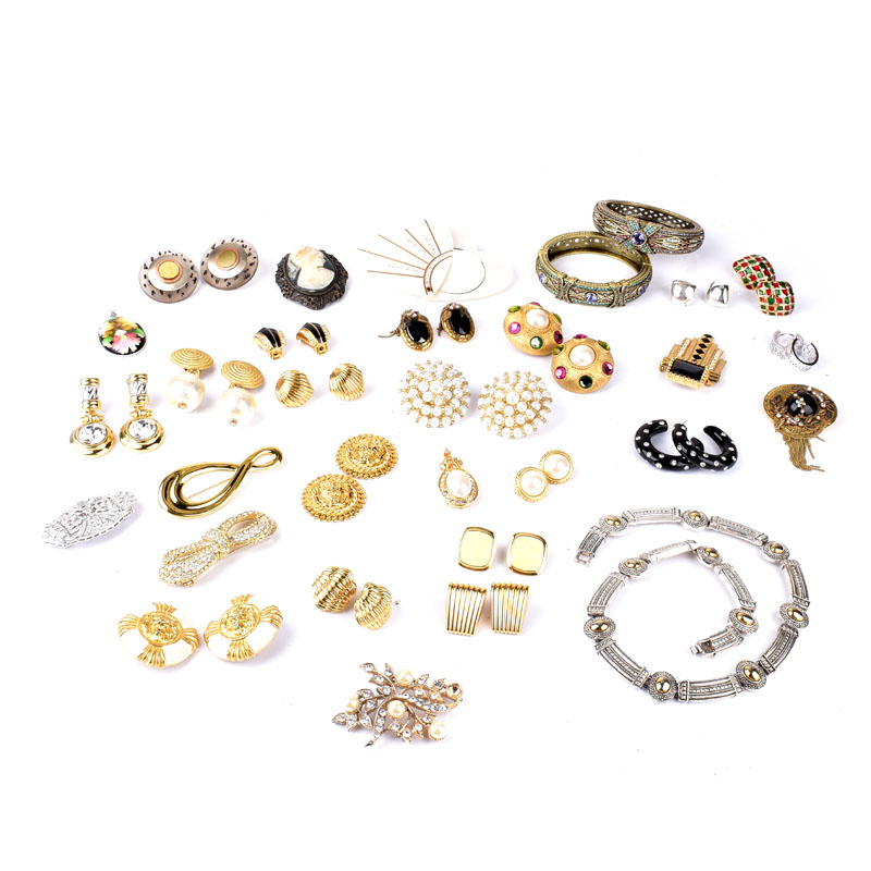 Collection of Vintage Costume Jewelry Accented with Faux Gemstones Including a Necklace, Bangle Bracelets, Brooches, Pendants, and Earrings.