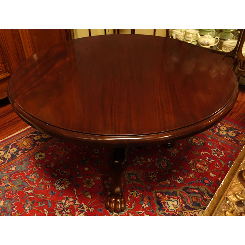 Antique Style Round Carved Mahogany Pedestal Table. Tripod baluster form base with paw feet.