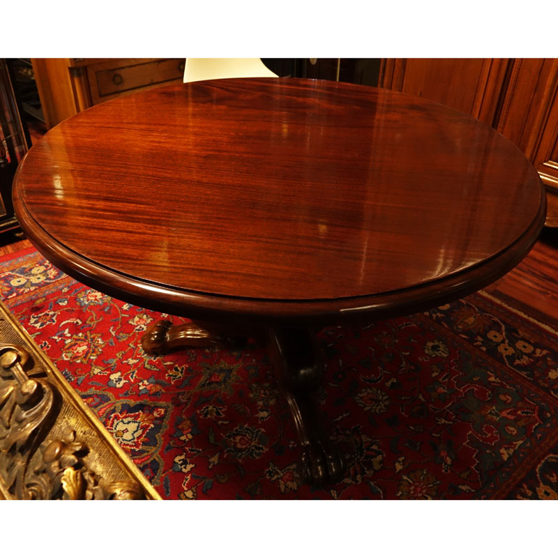 Antique Style Round Carved Mahogany Pedestal Table. Tripod baluster form base with paw feet.