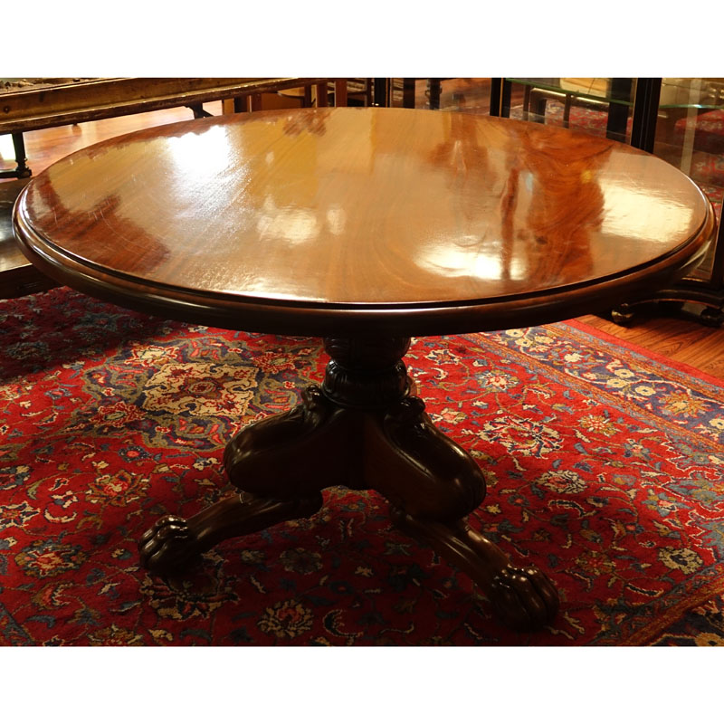 Antique Style Round Carved Mahogany Pedestal Table. Tripod baluster form base with paw feet.