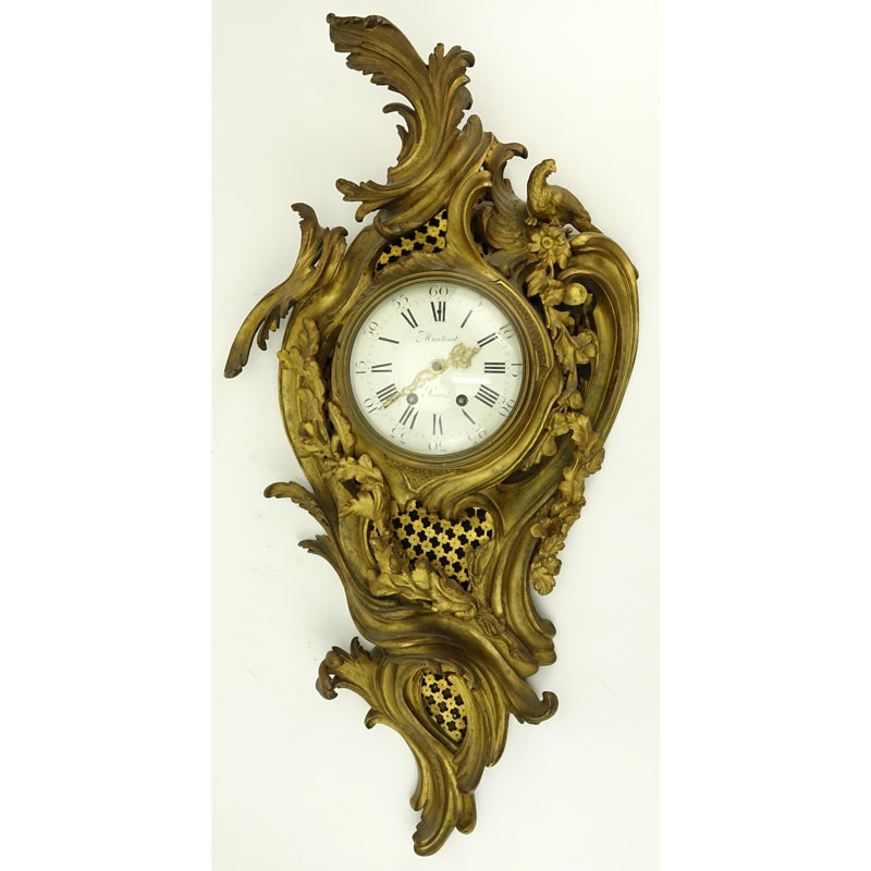 Antique French Gilt Bronze Cartel Clock. Not in running condition, rubbing to gilt. Measures 32" H x 17" W.