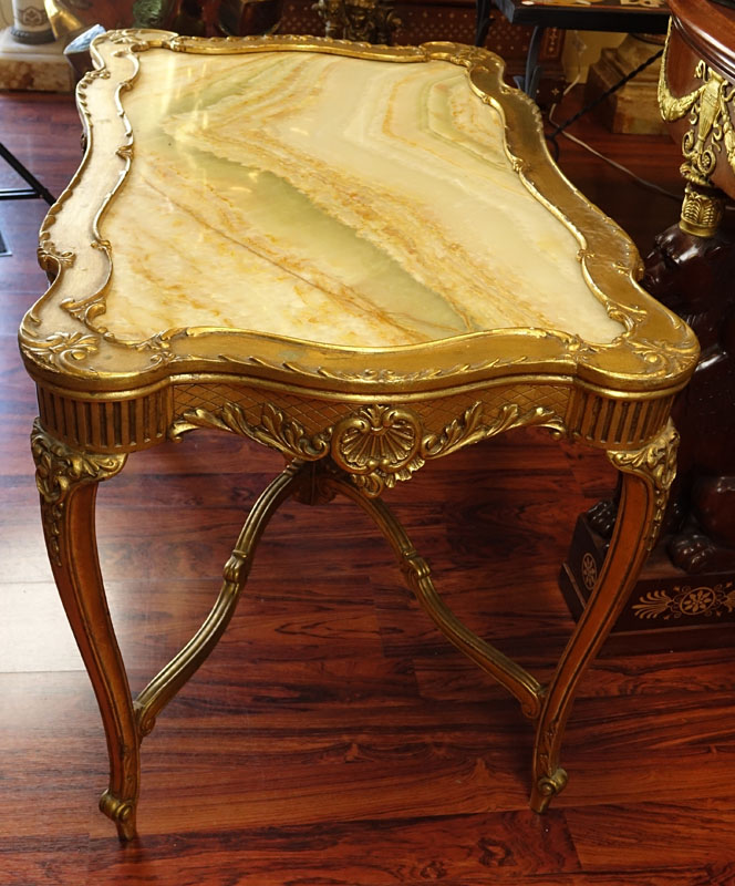 Early 20th Century Carved and Gilt Wood Center Table with Onyx Top.