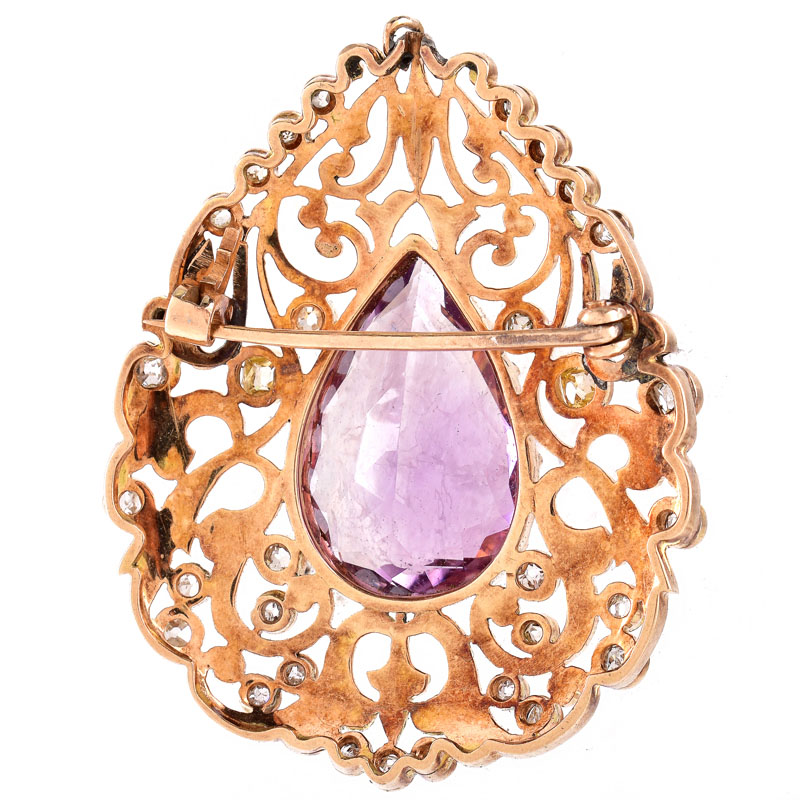 Vintage Circa 1940s Approx. 2.50 Carat Old Mine Cut Diamond, 10.0 Carat Pear Shape Amethyst and Enameled 18 Karat Yellow Gold Brooch.