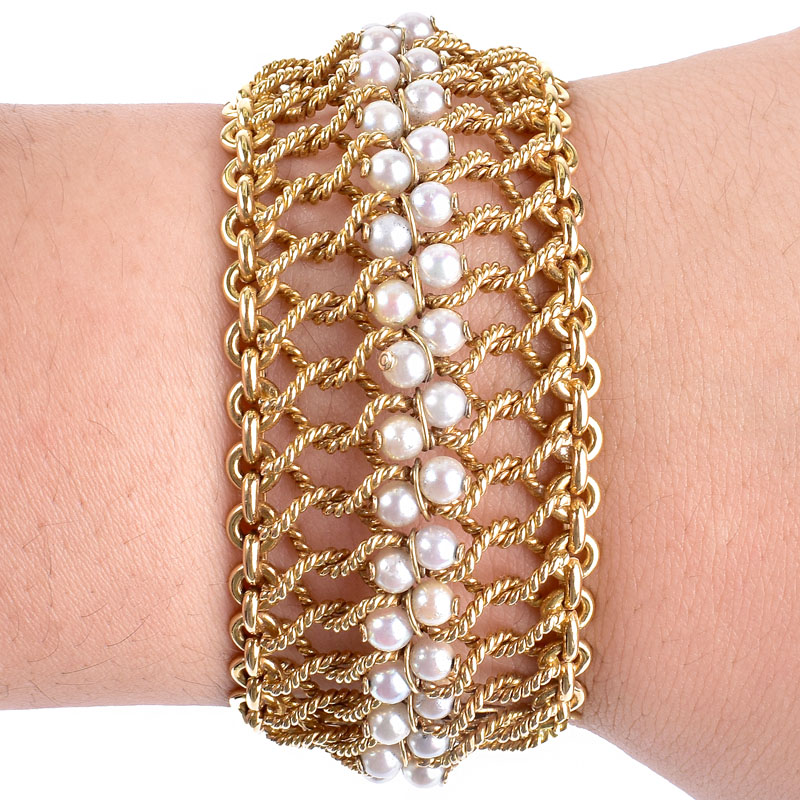 Retro 14 Karat Yellow Gold Woven Mesh Bracelet with Pearl Accents. Pearls measure 4mm, with good color and luster.