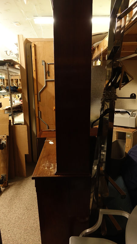 Antique Victorian Mahogany Bookcase. Two large glass display doors with gothic arches at the top, large fitted center drawer above two doors, key included.