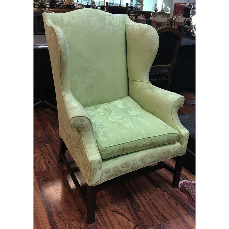 19th Century Wingback Chair on Carved Wood Stretcher.