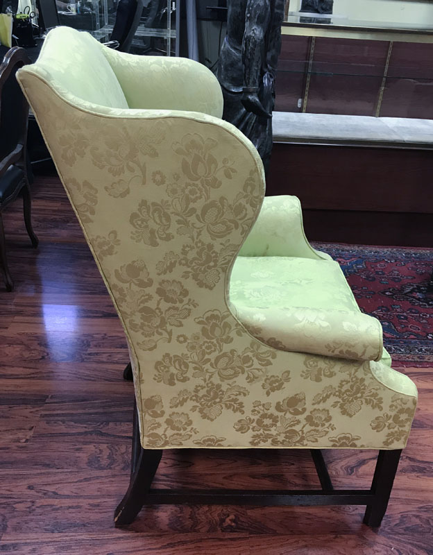 19th Century Wingback Chair on Carved Wood Stretcher.