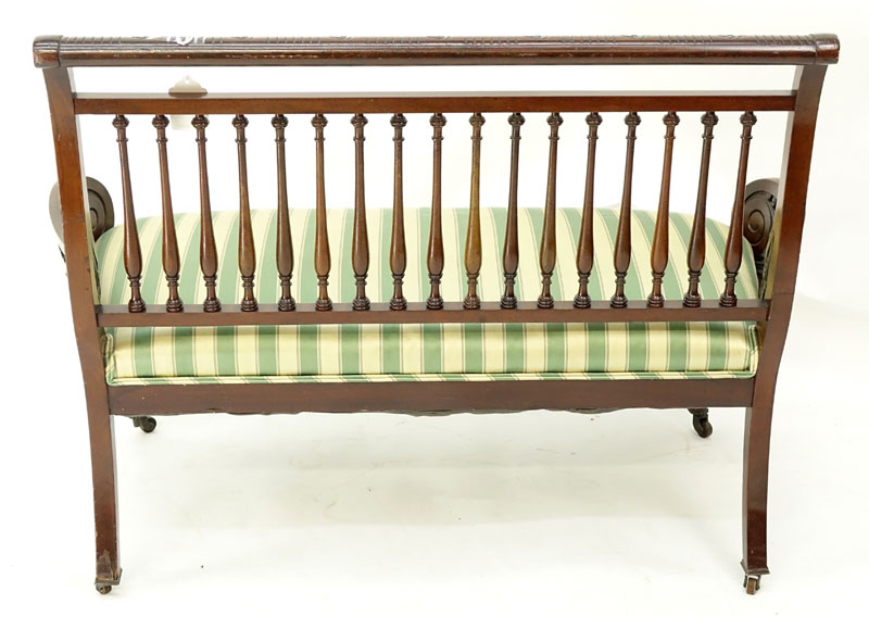 Mid Century Carved Wood and Upholstered Bench on Wheels.