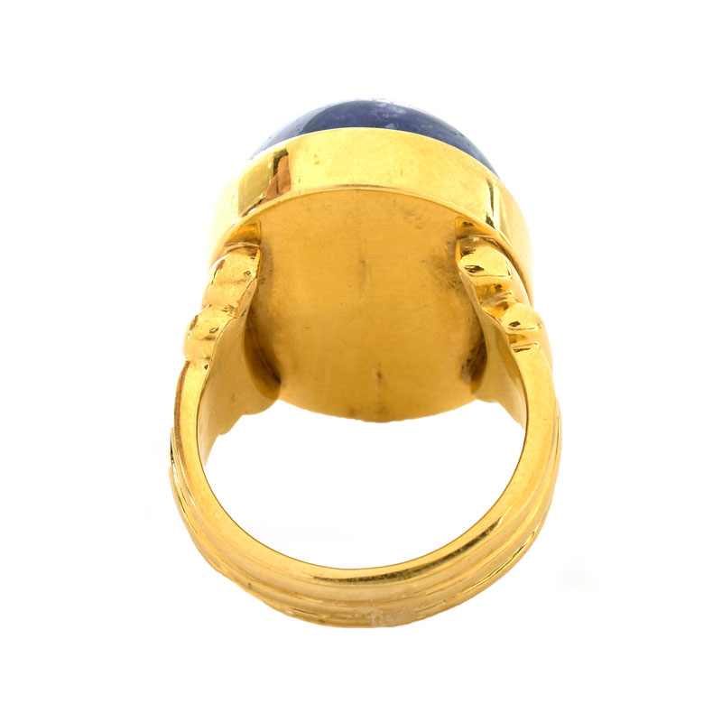 Vintage Approx. 30.0-35.0 Carat Oval Cabochon Tanzanite and 18 Karat Yellow Gold Ring.