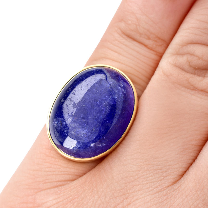 Vintage Approx. 30.0-35.0 Carat Oval Cabochon Tanzanite and 18 Karat Yellow Gold Ring.