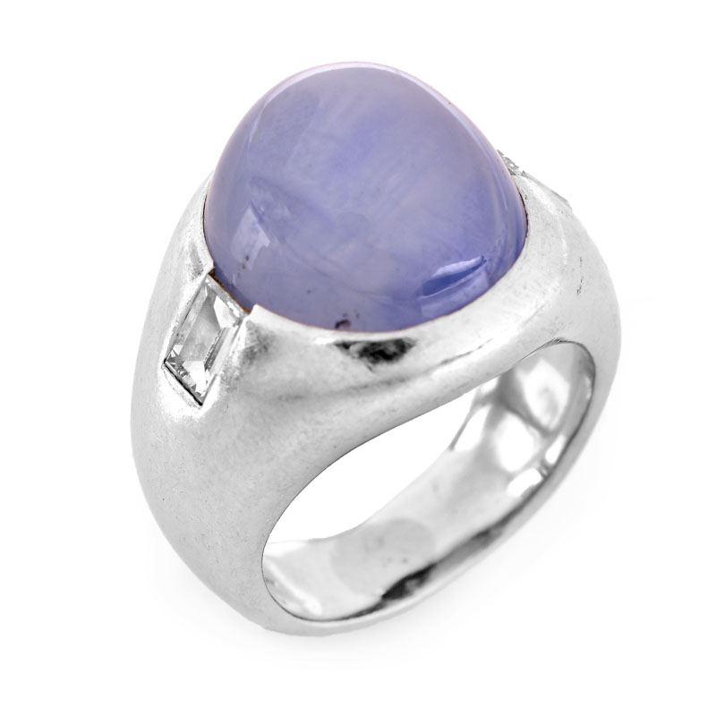 Approx. 15.0 Carat Oval Cabochon Star Sapphire, .70 Carat Emerald Cut Diamond and Platinum Ring.