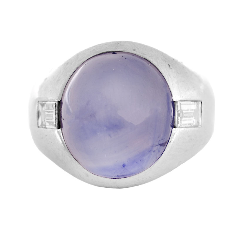 Approx. 15.0 Carat Oval Cabochon Star Sapphire, .70 Carat Emerald Cut Diamond and Platinum Ring.