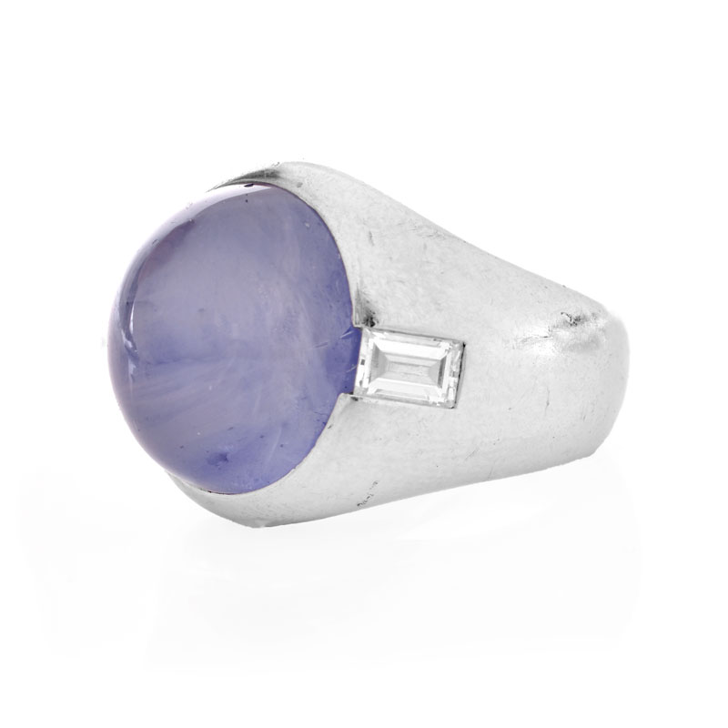 Approx. 15.0 Carat Oval Cabochon Star Sapphire, .70 Carat Emerald Cut Diamond and Platinum Ring.