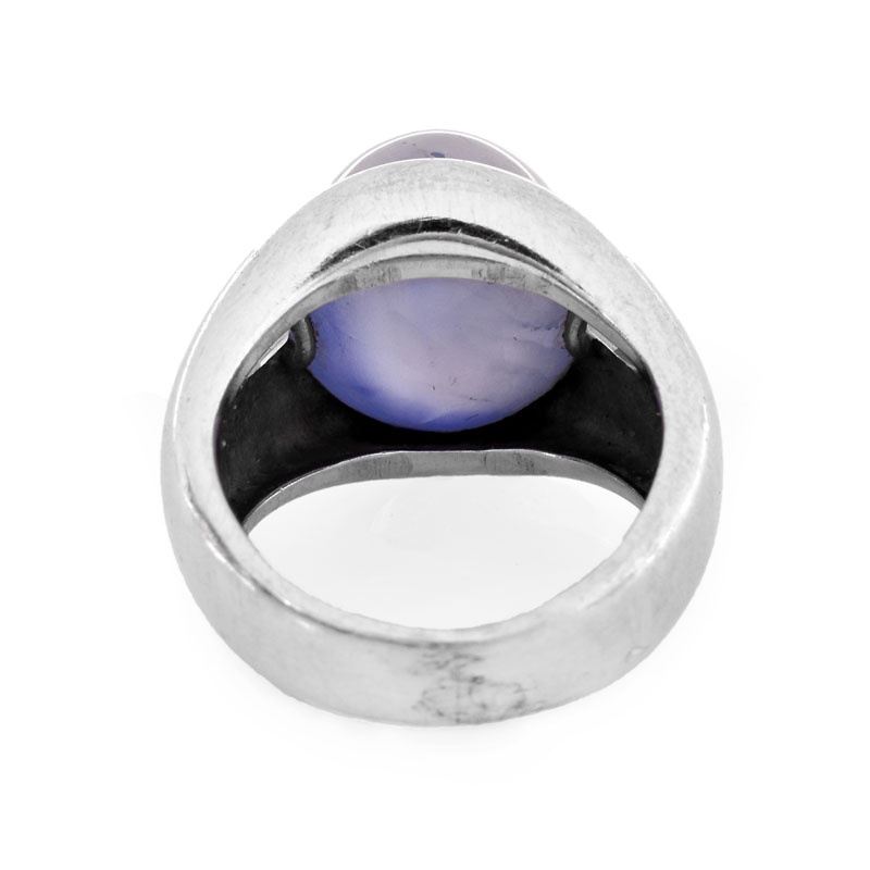 Approx. 15.0 Carat Oval Cabochon Star Sapphire, .70 Carat Emerald Cut Diamond and Platinum Ring.