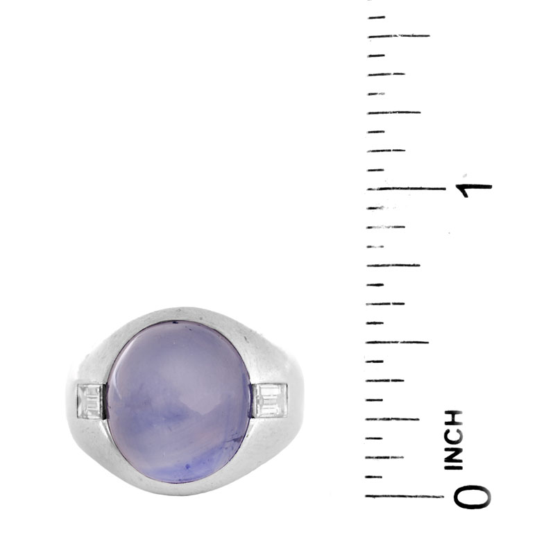 Approx. 15.0 Carat Oval Cabochon Star Sapphire, .70 Carat Emerald Cut Diamond and Platinum Ring.