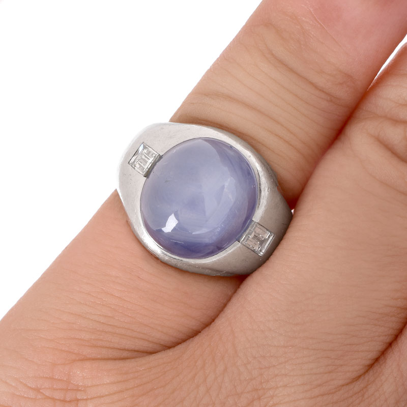 Approx. 15.0 Carat Oval Cabochon Star Sapphire, .70 Carat Emerald Cut Diamond and Platinum Ring.