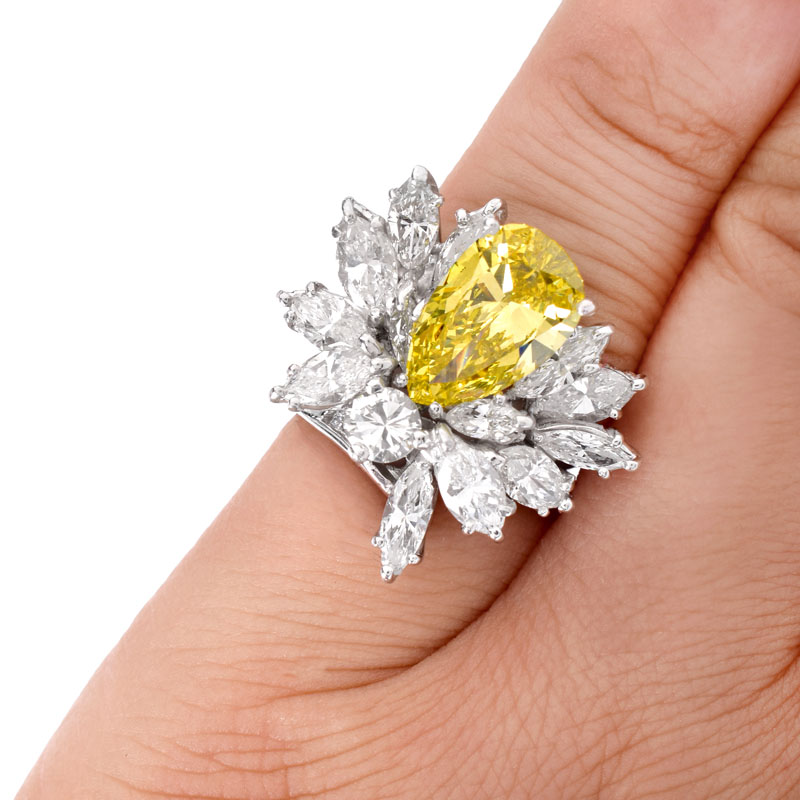 Vintage Circa 1960s Approx. 3.0 Carat Pear Shape Fancy Intense Yellow Diamond, 4.75 Carat Marquise, Round Brilliant and Baguette Cut Diamond and Platinum Ring.