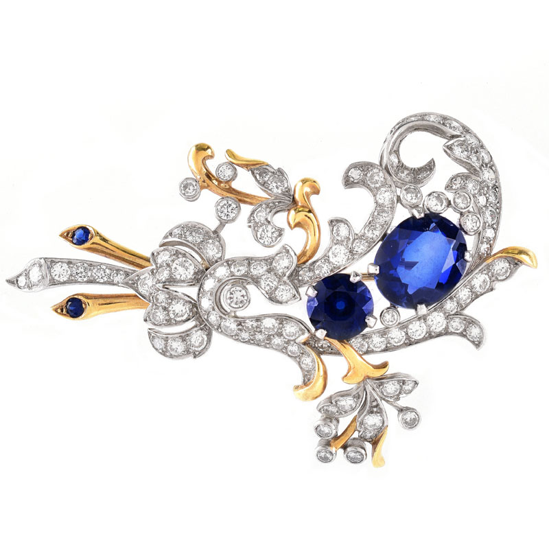 Vintage Round Brilliant Cut Diamond and 18 Karat Yellow and White Gold Brooch. Synthetic sapphire accents.