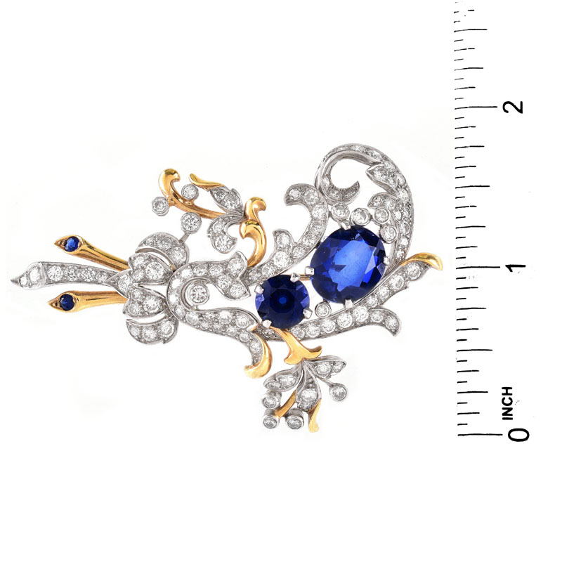 Vintage Round Brilliant Cut Diamond and 18 Karat Yellow and White Gold Brooch. Synthetic sapphire accents.