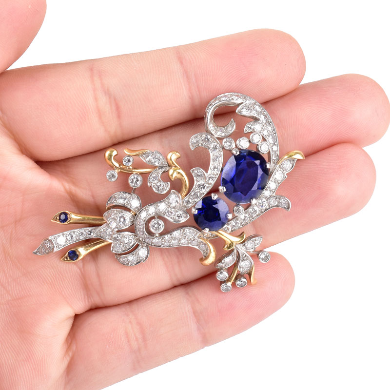 Vintage Round Brilliant Cut Diamond and 18 Karat Yellow and White Gold Brooch. Synthetic sapphire accents.