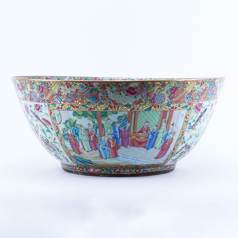 Monumental Chinese Export Rose Medallion Porcelain Punch or Center Bowl. Decorated with panels of court figures, birds and flowers within a dense floral and butterfly border.