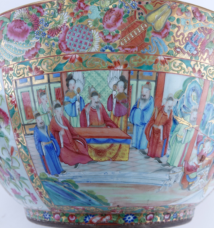 Monumental Chinese Export Rose Medallion Porcelain Punch or Center Bowl. Decorated with panels of court figures, birds and flowers within a dense floral and butterfly border.