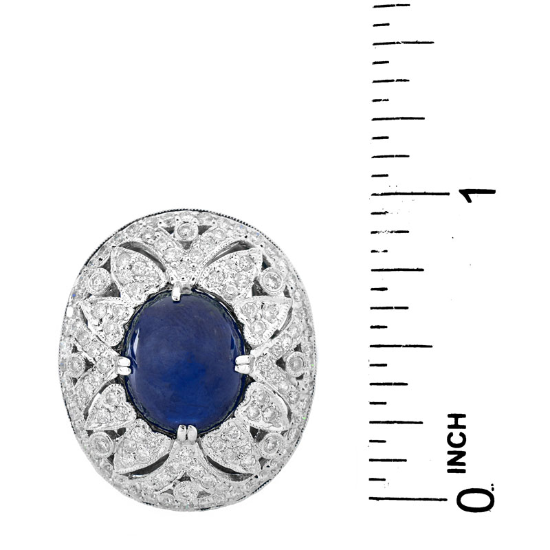 Approx. 6.27 Carat Oval Cabochon Sapphire, 1.50 Carat Round Brilliant Cut Diamond and 18 Karat White Gold Ring.