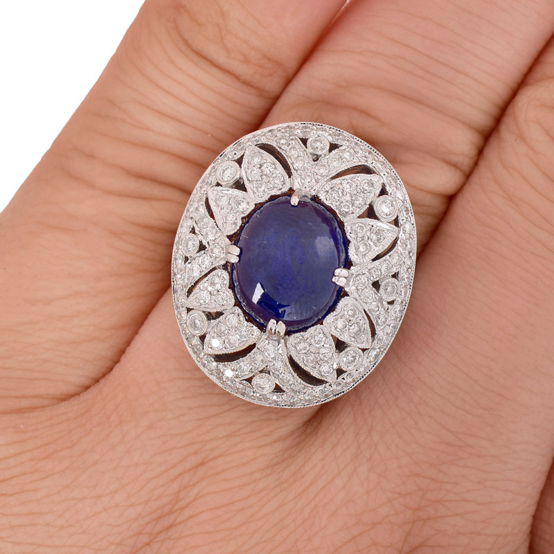 Approx. 6.27 Carat Oval Cabochon Sapphire, 1.50 Carat Round Brilliant Cut Diamond and 18 Karat White Gold Ring.