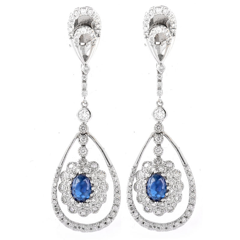 Approx. 2.0 Carat TW Oval Cabochon Sapphire, 2.50 Carat Round Brilliant Cut Diamond and 18 Karat White Gold Pendant Earrings.