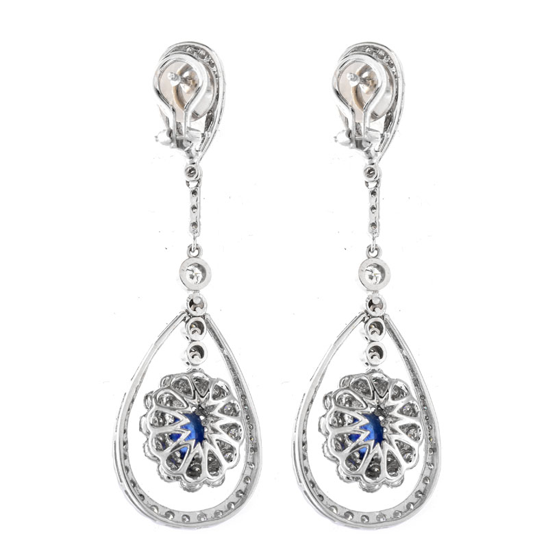 Approx. 2.0 Carat TW Oval Cabochon Sapphire, 2.50 Carat Round Brilliant Cut Diamond and 18 Karat White Gold Pendant Earrings.