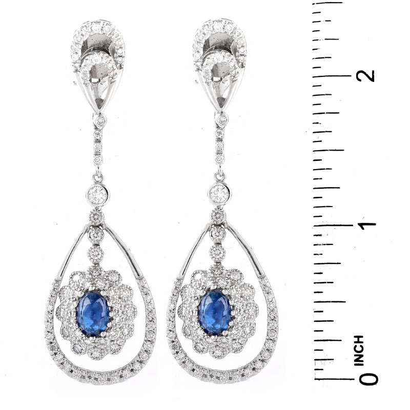 Approx. 2.0 Carat TW Oval Cabochon Sapphire, 2.50 Carat Round Brilliant Cut Diamond and 18 Karat White Gold Pendant Earrings.